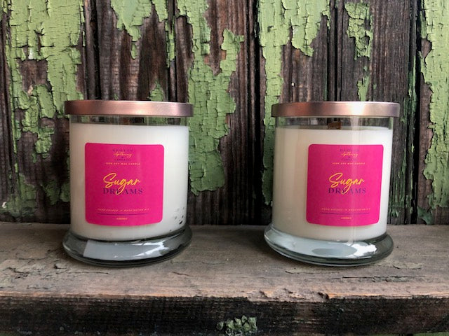 Sugar Dreams is our soft yet sweet, dreamy-candy fragrance that is sure to surprise your senses. This fruity scent consist of strawberries, raspberries, tonka beans, vanilla, sweet orange, lemon and light musk. All of our candles are made with 100% soy wax.