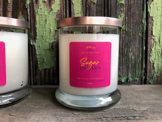 Sugar Dreams is our soft yet sweet, dreamy-candy fragrance that is sure to surprise your senses. This fruity scent consist of strawberries, raspberries, tonka beans, vanilla, sweet orange, lemon and light musk. All of our candles are made with 100% soy wax.